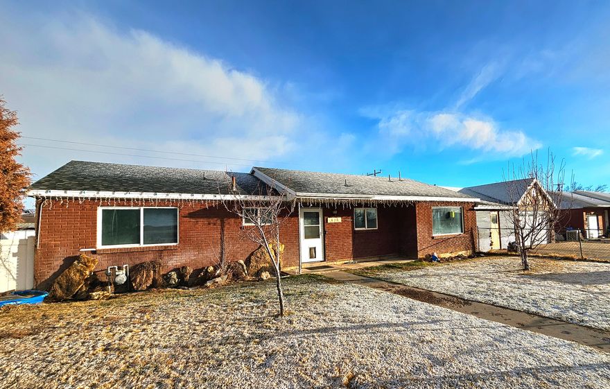 Welcome to this 5-bedroom, 2-bathroom home located in a great Vernal neighborhood just minutes from downtown, schools, parks, and baseball/softball fields. The bright living area features a cozy fireplace and plenty of natural light, creating a warm and inviting space to relax or entertain. The oversized mudroom offers excellent functionality with cold storage and extra space for organization, along with a single-car garage and abundant storage throughout. Step outside to the fully fenced backyard, perfect for kids, pets, and outdoor gatherings. With convenient access to shopping, dining, and walking parks, this home offers comfort, space, and an ideal location. With just a little paint and your personal touches, you can truly make it your own. Don't miss this great opportunity in the heart of Vernal!