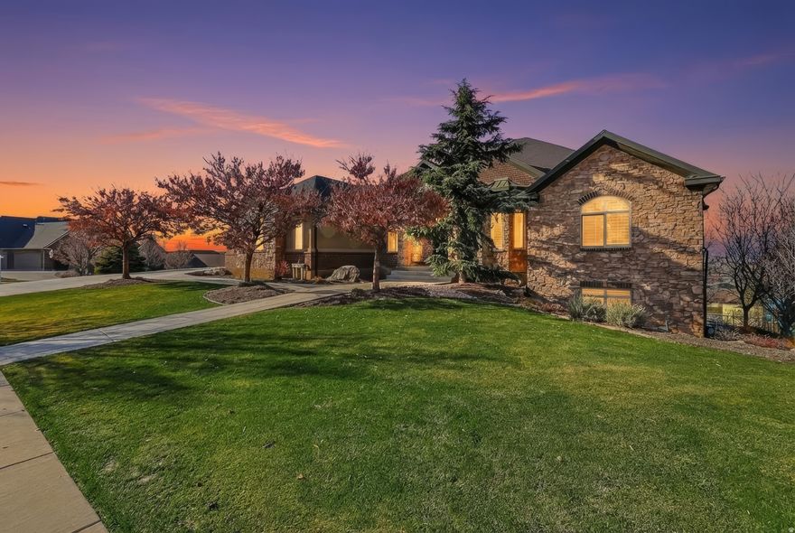 *This home is perfect for the family who wants room to grow, space to breathe, and views that remind you why you live in Utah. *With over 7,000 square feet of thoughtful design, this home blends luxury and functionality in every detail. The open-concept kitchen with granite counters, double ovens, and a large island becomes the heart of the home-ideal for hosting holidays, casual gatherings, or slow Sunday mornings by the double-sided fireplace that opens to a covered deck with sweeping mountain and valley views. *The primary suite feels like a retreat-complete with vaulted ceilings, a soaking tub, walk-in shower, and generous closet space. Downstairs, a full basement kitchen, sauna, and separate entrance make it perfect for multi-generational living, extended family stays, or even a private guest suite. *For the hobbyist or collector, the four-car epoxy-floored garage (with a heated bay) and massive storage areas provide the space you've been craving. And when it's time to unwind, adventure is right outside your door-with trails, lakes, and ski resorts just minutes away. *This home is designed for those who appreciate craftsmanship, comfort, and connection-a place where memories are made, laughter echoes, and every sunset feels like a gift.