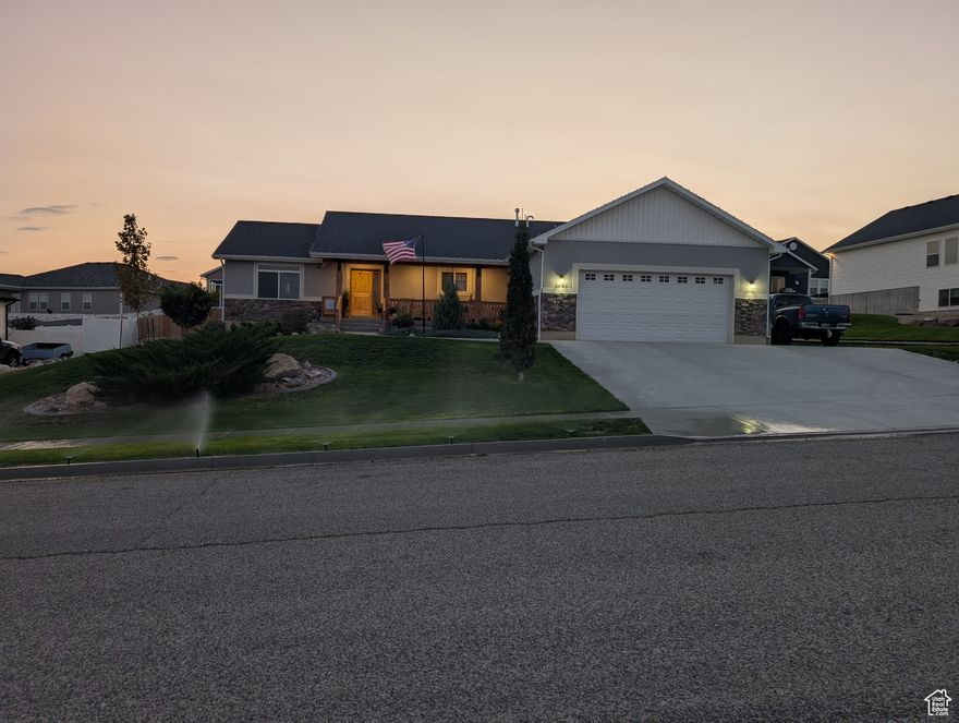 This is a beautiful ranch style home that sits on the Foothills of the mountain in the small town of Tremonton, Utah. Box elder county fairgrounds is approximately 2 mi from the home. Go out and enjoy some good old fashioned rodeo or truck pools or other events that are held at the fairgrounds!  The main town is approximately 2 mi from the home. The hospital is approximately 1 mi from the home. Bear River high School is approximately 2 mi from the home. Go out and enjoy some high school football! This is small town living at its best.  Front porch view of the mountain range as well as Tremonton City just below. The main level and basement are completely finished. With seven bedrooms and three baths. A large family room in the basement with a wet bar. There are four bedrooms and a full bath in the basement. The upper level has three bedrooms and two full baths. Located in a very nice quiet subdivision. The yard is equipped with a sprinkler system and the backyard is fully fenced with cedar fencing. Fully landscaped with Evergreens, Sycamore tree, Pacific sunset tree, a Plum tree, Peach tree, Cherry tree, and an Apple tree. This home stands out above the rest and is a must-see!