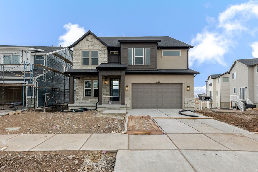 Come home to Ridgehorne at Mt. Saratoga-a master-planned community where comfort and convenience meet! Our open-concept single-family floorplans are designed to maximize space while still offering plenty of privacy. Surrounded by future parks, trails, and wide-open spaces, Ridgehorne is perfect for both relaxation and adventure. Enjoy amazing community amenities, including a clubhouse, pool, basketball court, bark park, playgrounds, and more. With Utah Lake, The Ranches Golf Club, local shopping, dining, and Pioneer Crossing all close by, you'll love the location just as much as the home. Reach out today to learn more or schedule your visit! (PEYTON LOT 701)