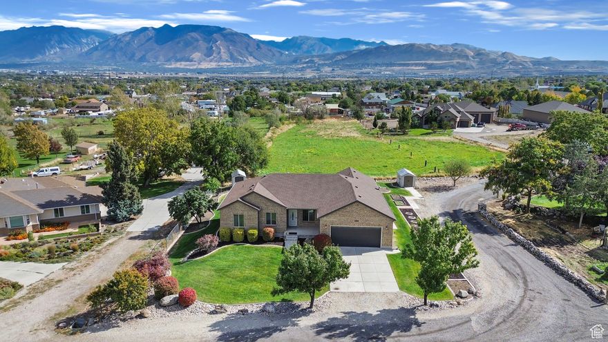 This immaculate brick rambler sits on a rare 2-acre horse property with breathtaking mountain views. Featuring 5 bedrooms, 3 bathrooms, and a walk-out basement already plumbed for a second kitchen, this home offers endless flexibility for your lifestyle. The spacious 2-car garage, pristine condition, and thoughtful layout showcase true pride of ownership. With plenty of room to add a detached garage, barn, or other outbuildings, the possibilities are wide open. Enjoy peaceful country living just minutes from shopping, dining, and freeway access. The property includes irrigation water and may be subdivided-making this a truly exceptional find for those seeking space, views, and convenience.