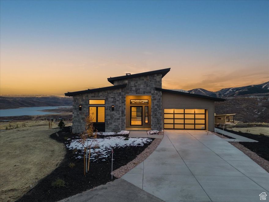 Explore Amanti Lago, an exceptional new community near Park City, offering a limited collection of just 28 homesites. Positioned above the peaceful Jordanelle Reservoir, each residence is a testament to luxury crafted for the select few. Enjoy breathtaking views of Deer Valley's ski slopes, immerse yourself in the tranquility of nature through nearby walking and biking trails, and savor year-round recreation, from skiing to boating to golfing. Welcome to your opulent retreat in the midst of an outdoor paradise. Your dream home awaits you at Amanti Lago. The Valentino Home Plan provides main floor living at its finest. Impressive entry with great room providing 14 ft. ceiling, soaring windows, and generous entertaining space. The primary suite offers views of the mountains and lake with a spacious spa like bathroom. The main floor includes a second bedroom and home office. Bring the outdoors in with the multi slide glass door to the covered deck. Gorgeous staircase is open to the walk out basement with family room, 2 additional beds and baths and even more outdoor space. Photos are of a previously built model home. Colors and finishes to vary..  Buyer to verify all.