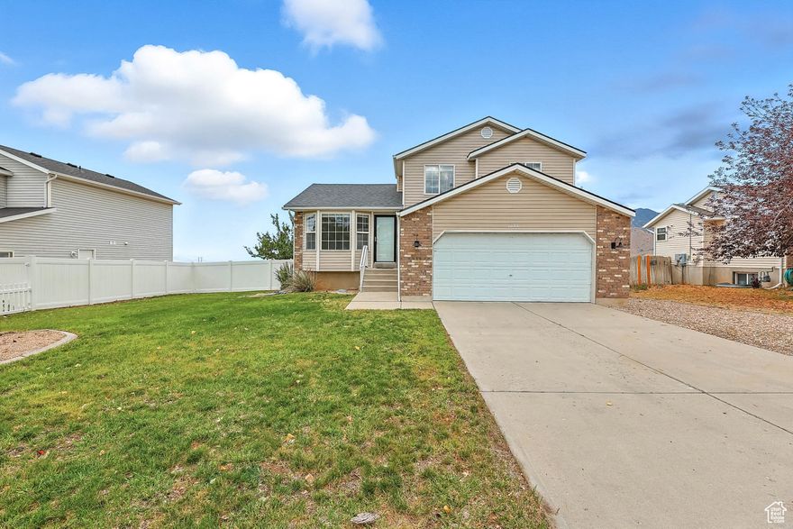 Welcome to this beautifully updated 3 bedroom, 2.5 bath home offering modern updates and breathtaking views. Step inside to find fresh paint, new flooring, and a brand new roof, giving you peace of mind and move - in readiness. The main living areas are bright and open, leading out to a spacious deck perfect for entertaining or simply relaxing while taking in the unobstructed views of the valley, mountains, Great Salt Lake and some outstanding Tooele county sunsets.  Newer A/C and instantaneous hot water heater. The unfinished basement is mostly above ground, with abundance of natural light. It is a clean slate with rough plumbing for an additional bath- ready for you to design the ultimate family room, additional bedrooms, guest suite or home office to suit your needs.  Outside, you'll enjoy the convenience of RV parking, giving you space for all your toys and extra vehicles. Square footage figures are provided as a courtesy estimate only. Buyer is advised to obtain an independent measurement and verify all information.