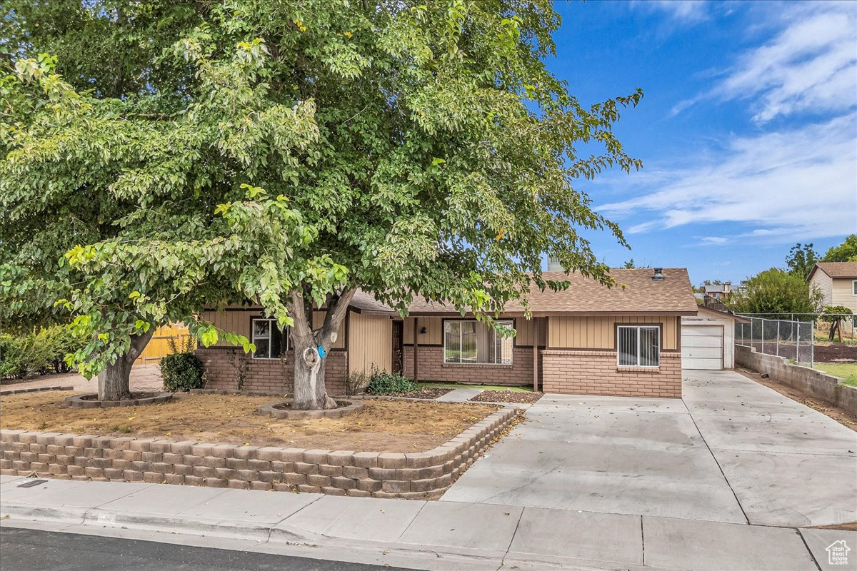 ***OFFER VERBALLY ACCEPTED, WAITING ON SELLER SIGNATURES***Great St. George home on nearly a quarter acre. Located in a nice neighborhood and on a quiet street. Large yard with many possible layouts and finishing configurations. Large rear patio for entertaining. Tons of off-street parking and a single car garage with attached workshop. Interior is complete with laminate flooring, ceiling fans, can lights, and double-paned windows. Large kitchen with updated cabinet space, stainless steel fridge, and bar. Large living room with tons of natural light, and direct access to dining/kitchen. 2 bathrooms and a large laundry room round things off. Tons of rooms for RV parking on west side of home.