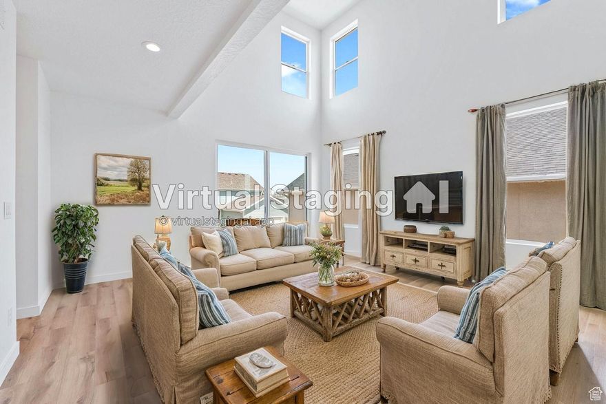 Beautiful, brand new home, in this desirable community in West Jordan. This South facing home boasts stunning unobstructed views of the Valley and Wasatch Mountains. You will especially love the views from the large covered front porch, den/office, and master bedroom. The 18 foot ceilings in the family room and amble natural light provide the wow factor. The kitchen is loaded with upgraded appliances, Quartz countertops, Cabinet vent hood, custom built in Cabinet pantry, and cabinet hardware. Enjoy 3 bedrooms, 2.5 baths, plus a den, 18 foot ceilings in the family room, an oversized garage, and room for 2 more bedrooms a bathroom and living room in the unfinished basement. You can also enjoy extra privacy with no homes build directly across the street and a larger partially maintained front yard. Plus the back yard that can be fenced in.
