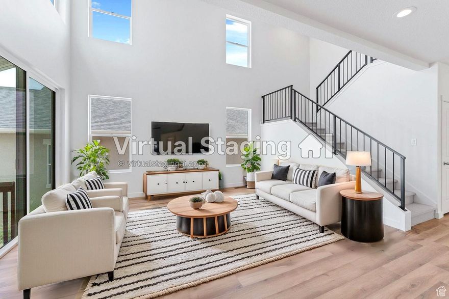 Beautiful, brand new home, in this desirable community in West Jordan. MASSIVE HOLIDAY INCENTIVE ON THIS HOME IF CLOSED BEFORE JAN 1st! This South facing home boasts stunning unobstructed views of the Valley and Wasatch Mountains. You will especially love the views from the large covered front porch, den/office, and master bedroom. The 18 foot ceilings in the family room and amble natural light provide the wow factor. The kitchen is loaded with upgraded appliances, Quartz countertops, Cabinet vent hood, custom built in Cabinet pantry, and cabinet hardware. Enjoy 3 bedrooms, 2.5 baths, plus a den, 18 foot ceilings in the family room, an oversized garage, and room for 2 more bedrooms a bathroom and living room in the unfinished basement. You can also enjoy extra privacy with no homes build directly across the street.