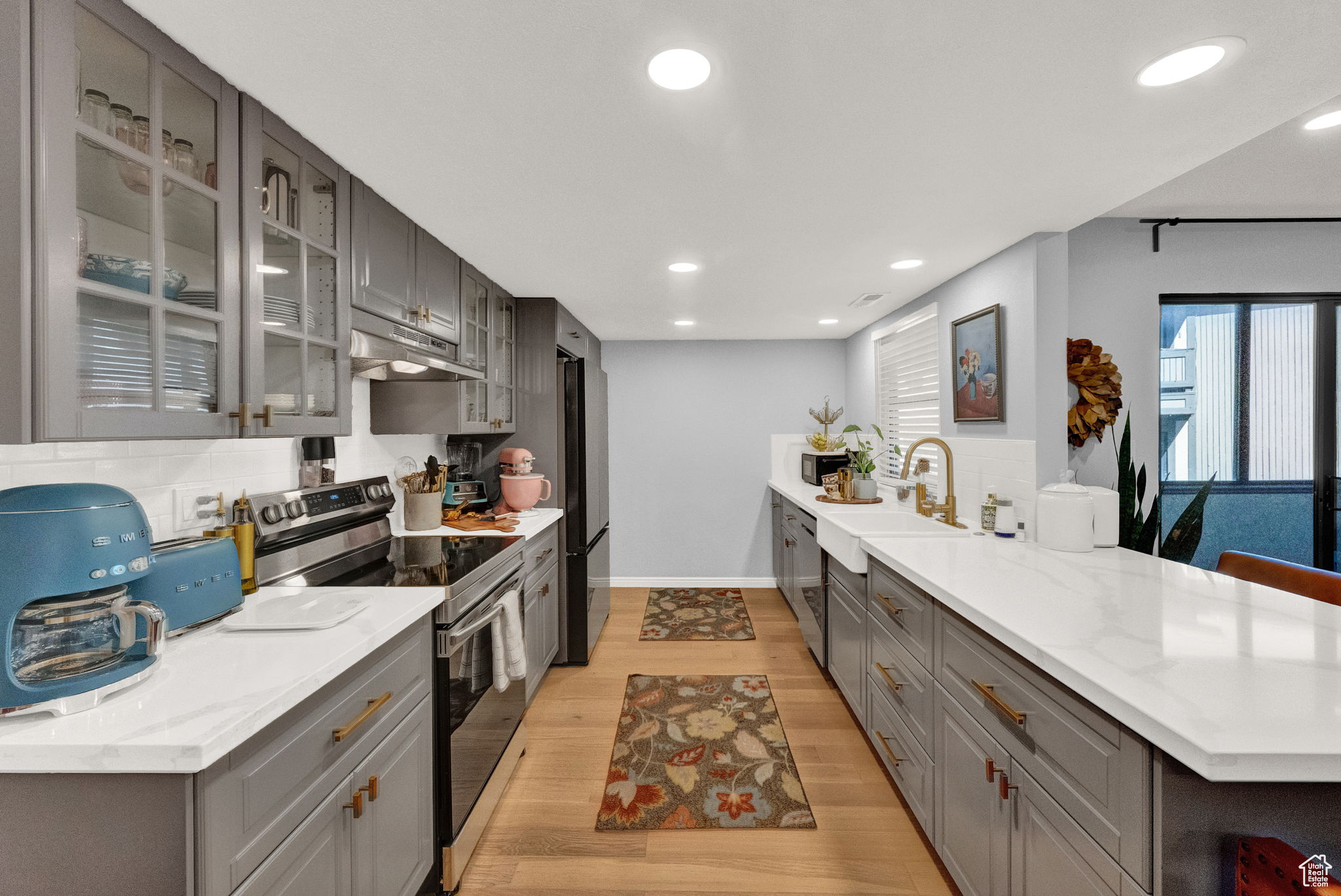 This beautiful first-floor end unit is located in a desirable gated community. Immaculate kitchen with an open floor plan, featuring new cabinets, quartz countertops, and all new appliances. Both bedrooms come with walk-in closets and attached bathrooms, while a bonus room offers the perfect space for an office or additional storage. The hall bathroom has been completely remodeled, including new plumbing, a tub/shower, and vanity, and the master bathroom features elegant granite countertops. An enclosed porch further enhances the living space. The two-car garage provides ample storage and a workbench area. The community offers fantastic amenities, including a pool, clubhouse, gym, gardens, and RV parking, all conveniently located close to ski bus route, freeways, shopping, restaurants and much more.