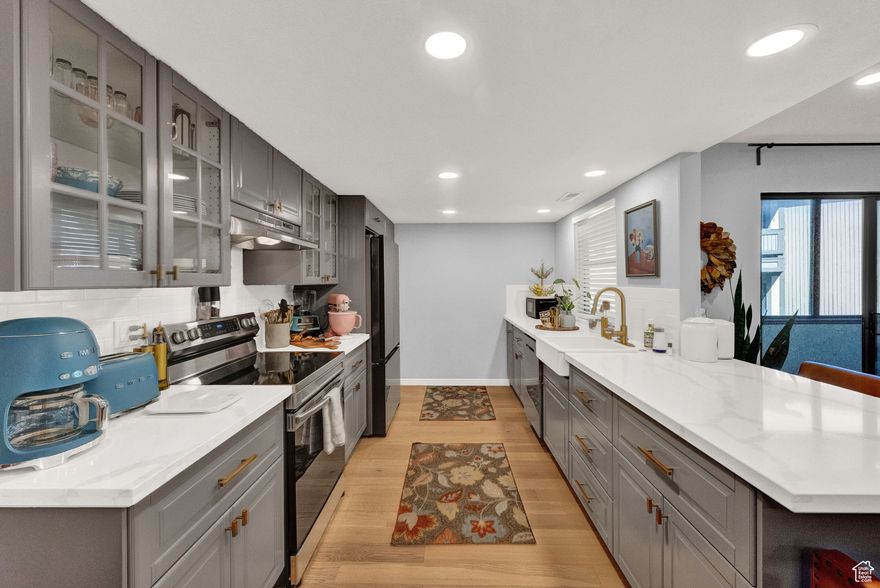 This beautiful first-floor end unit is located in a desirable gated community. Immaculate kitchen with an open floor plan, featuring new cabinets, quartz countertops, and all new appliances. Both bedrooms come with walk-in closets and attached bathrooms, while a bonus room offers the perfect space for an office or additional storage. The hall bathroom has been completely remodeled, including new plumbing, a tub/shower, and vanity, and the master bathroom features elegant granite countertops. An enclosed porch further enhances the living space. The two-car garage provides ample storage and a workbench area. The community offers fantastic amenities, including a pool, clubhouse, gym, gardens, and RV parking, all conveniently located close to ski bus route, freeways, shopping, restaurants and much more.