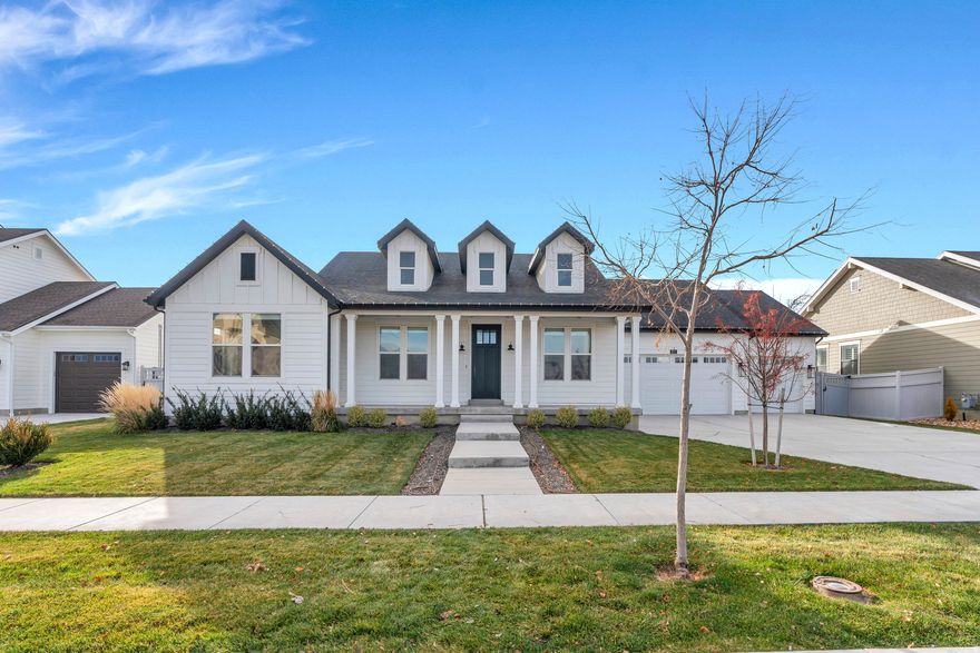 Experience luxury living in this stunning 2022 rambler located in Saratoga Springs' desirable Beacon Pointe community. This beautifully crafted home offers 4,772 sq ft of sophisticated design, featuring 5 spacious bedrooms, 4 bathrooms, and an inviting great room with vaulted ceilings and large sliding glass doors that fill the space with natural light.  The gourmet kitchen boasts granite countertops, double ovens, a gas range, and an open layout ideal for entertaining.   Enjoy single-level living on the main floor with 2 bedrooms, a large family room, formal dining, and a serene primary suite with a separate tub and shower. The fully finished basement (80%) adds 3 additional bedrooms, generous living space including a theater room and ample storage. Situated on a .24-acre fully landscaped lot with fenced yard, covered patio, and beautiful mountain views, this home is perfect for peaceful living and outdoor enjoyment. Move-in ready, meticulously maintained, and perfectly located-this home truly has it all. Square footage figures are provided as courtesy estimates only and were obtained from county records. Buyer is advised to obtain an independent measurement.