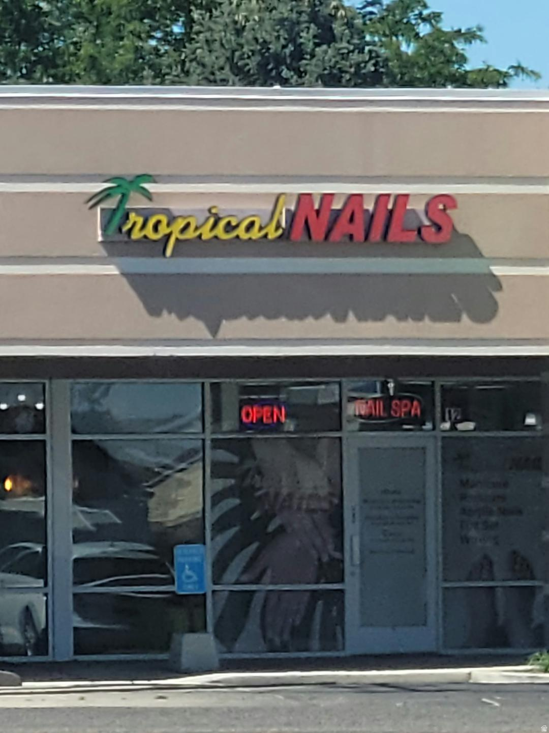 Commercial storefront with large display windows and a visible entrance