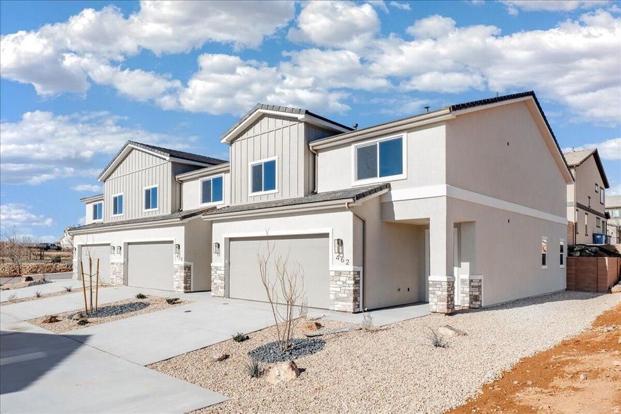 Welcome to this brand-new 4-bedroom, 2.5-bath townhome in the heart of Hurricane, Utah, offering 2,346 sq ft of beautifully designed living space. Thoughtfully upgraded throughout, this home features granite countertops, engineered wood flooring, and tile showers and baths that bring both style and durability together. The open-concept layout is perfect for entertaining or everyday living, while the large bedrooms provide comfort and flexibility for family, guests, or a home office. Enjoy the convenience of a full-size 2-car garage and low-maintenance living with HOA dues of just $100 per month. Ideally located near outdoor adventure, you're just minutes from world-class hiking, biking, and sightseeing at Zion National Park, with easy access to local shopping, dining, and schools.  Whether you're looking for a primary residence, second home, or investment property, this move-in-ready townhome delivers modern finishes, generous space, and an unbeatable Southern Utah lifestyle.
