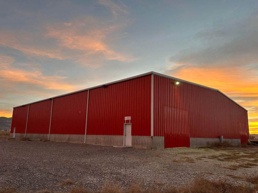 Fantastic opportunity to lease this large metal building in a great location of Parowan! Would make for a great warehouse or manufacturing facility. The building features 12,500 sq ft with some land ability for storage of 4 acres. Currently has a 200 amp electrical service with ability to have 400 amp with 3 phase power. Currently has 1 overhead door of 16X16 in size but could have several other door openings that would be 12X12 if needed. Concrete floor throughout the interior of the building. Propane heating. There is 1 bathroom inside the building with 2 portables outside. Just a few minutes from the north Interstate 15 Parowan exit. Paved road leading up to the property. Don't delay, come see today!