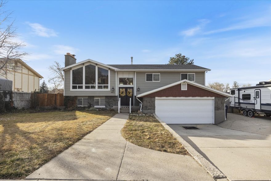 Enjoy majestic mountain views through oversized custom front windows - mountain living without the mountain commute. Positioned at the mouth of the canyon just off 9400 S, this home offers exceptional access to outdoor recreation, from quick after-work hikes in the foothills to a short drive to nearby ski resorts, along with year-round trail access for hiking, biking, and exploring.  The deck extends the living space outdoors and provides an ideal setting for relaxing or entertaining while taking in the surroundings.  One bedroom is currently configured as a professional salon with plumbing in place, offering flexible use as a home-based business, creative studio, or an easy conversion back to a traditional bedroom.  The location delivers the best of both worlds - scenic views and quiet neighborhood living with convenient access to major roads, shopping, dining, and nearby amenities.