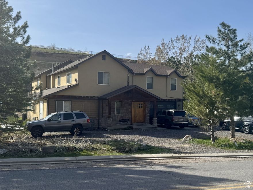 MOTIVATED SELLER! Large Price Reduction! Don't miss this country living at the edge of the city! This property features 0.86 acres with livestock corrals and plenty of landscape to host summer fire pit gatherings. The home features 5 bedrooms with 3 full baths at 3558 square feet. The kitchen has an open floor plan for those friend and family gatherings. The HVAC system has separate controls for the upper and lower living spaces for your comfort. Lower HVAC replaced June 2025 with 10 year manufacturer warranty. The master suite and one guest bedroom have balconies overlooking the property. Wildlife and panoramic views are throughout the Elk Ridge area. Drive up Loafer Canyon Road for more mountain scenery. Bring offer!