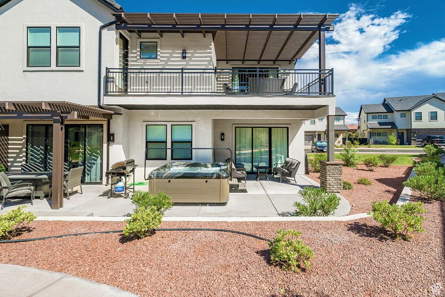 Experience the best of Ocotillo Springs Resort in scenic Santa Clara. This fully furnished 5-bedroom, 5.5-bathroom townhome offers nearly 3,000 sq ft of thoughtfully designed space, ideal for relaxing getaways or as a short-term rental investment. Built in 2020, it combines modern comfort with incredible resort-style amenities.  Inside, you'll find a spacious open floor plan, designer finishes, an in-home arcade, and a private 2-car garage with an EV charging station. Step outside to your own private hot tub and BBQ area, perfect for entertaining after a day of adventure. The home is ideally located directly behind the community pool, splash pad, and pickleball courts for easy access to family-friendly fun and relaxation.  Additional community amenities include a clubhouse with a pool table, ping pong, fitness center, and outdoor spa. With ample guest parking, low-maintenance living, and St. George's year-round sunshine, this home offers the ultimate desert retreat.  Buyer to verify all information, deemed reliable, however buyer to verify all info including utilities, rental restrictions, and HOA information if applicable.