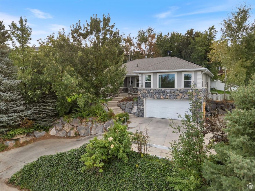 Exquisite Draper home nestled at the top of a private cul-de-sac. Stone-front design with open living spaces, bonus room above garage, refined finishes, and full mother-in-law apartment. This home is conveniently powered by solar. Great outdoor amenities close by including golfing, and both hiking and biking trials.