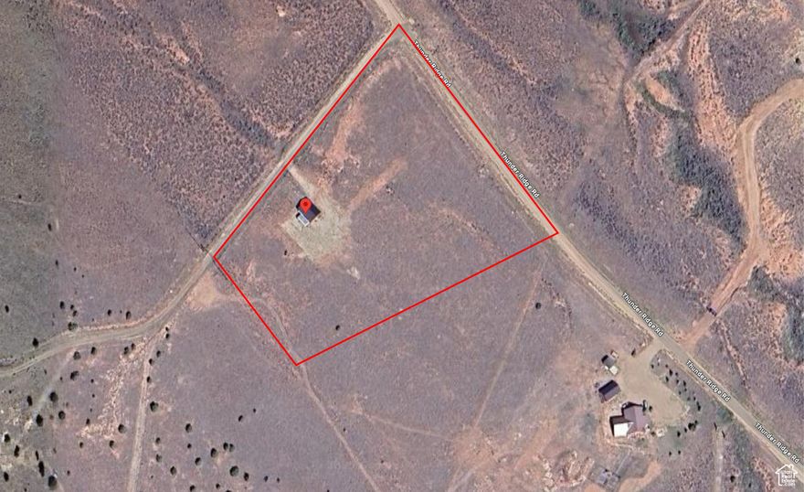 Escape to 5 acres in Thunder Ridge Air Park, Fruitland UT-your gateway to adventure. This property features a powered garage ready for RVs, toys, or a workshop, plus partial fencing and water available. Surrounded by stunning mountain views with easy access to recreation, it's the perfect base for pilots, outdoor enthusiasts, or anyone seeking space and serenity. Bring your vision and make this versatile property your own-whether as a weekend retreat, aviation base, or full-time residence site.