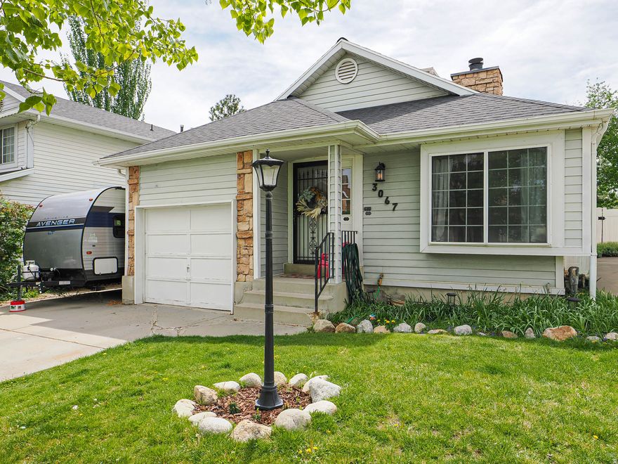 Situated in the desirable Meadow Green Farms subdivision, this darling rambler is surrounded by a quiet, neighborly setting that truly feels like home. The kitchen features granite counters and knotty alder cabinets.  Lovely laminate floors on the main floor-2020.  You will love the formal dining area, vaulted ceilings, fireplace, and two family rooms.  This home features 4 spacious bedrooms and 2 full bathrooms.  The private, secluded backyard retreat has a spacious patio -- perfect for relaxing or entertaining.  Water heater and downstairs laminate is new.  The roof was replaced in 2024.  New furnace in 2023.  Newer appliances 2019.  Remodeled downstairs bathroom 2018.  Ideally located within walking distance to schools, TRAX, and shopping, including a nearby grocery store.  Just a 3-minute drive to Jordan Landing and the golf course, plus a short 5-minute walk to the neighborhood park. With so much to offer, this home is a must-see!  Packed with features and charm, this is the one you won't want to miss!    Square footage figures are provided as a courtesy estimate only and were obtained from County Records .  Buyer is advised to obtain an independent measurement.