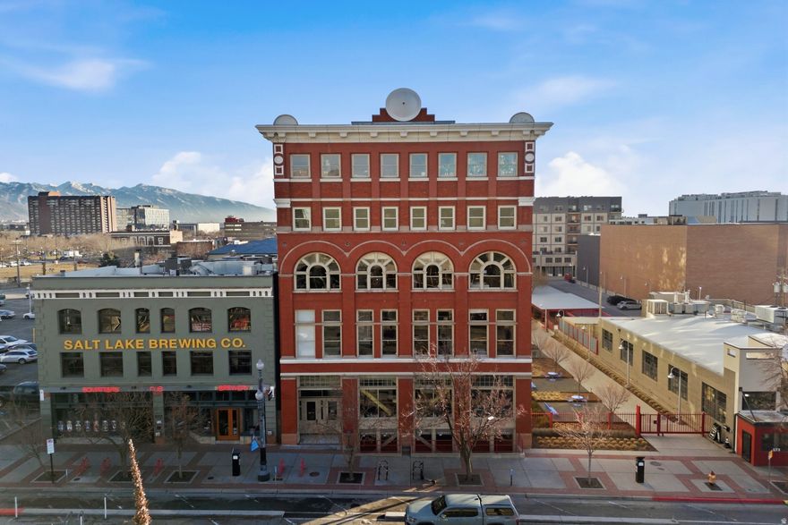 Experience a stunning renovation in the iconic Broadway Lofts in the heart of downtown Salt Lake City. A true luxury loft with nearly 2,000 square feet and incredible city and mountain views, this loft will provide an inspiring welcome at each arrival. Stunning gourmet kitchen with gray lower cabinets, horizontal wood grain upper cabinets, quartz countertops with waterfall edge and high end appliances including Subzero refrigerator, Wolf gas range and wall oven. Concrete construction and end walls aid in creating a quiet space. Beautifully remodeled spa-like baths. Walk-in closet with built-ins. Hardwood floors throughout. On demand water heater, reverse osmosis system plus building provides soft water. Gracious common areas with fire pit, BBQ and seating areas for relaxing. Gated community with secured parking(space #33) and on site storage space complete this unit for the ultimate urban experience. Pet friendly community. All of this is just steps from Salt Lake's best entertainment, dining and shopping and less than 15 minutes to Salt Lake International Airport. Don't miss out, call for your appointment today. Buyer to verify all.