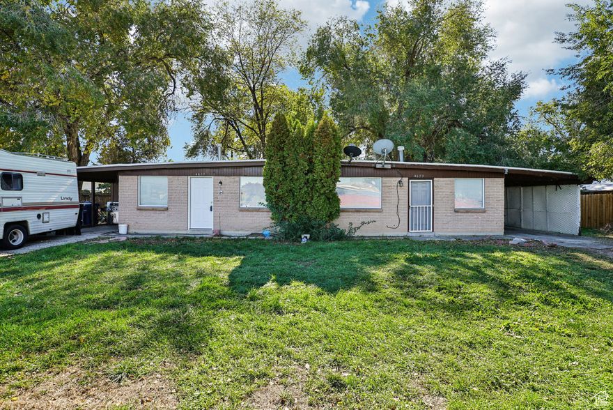 Consistently performing duplex located in a quiet, mostly single-family neighborhood of West Valley City. The roof was completely re-done last week. Each unit offers 2 bedrooms and 1 bathroom, with carport parking and in-unit laundry hookups. Both units feature a mix of tile, hardwood, and carpet flooring, and each has a separately fenced backyard. Utilities are individually metered for gas and electricity. One unit was recently updated.. Current rents are $1199 and $1250 per month. Only showing at the open house, so don't miss out. Buyer to verify all information