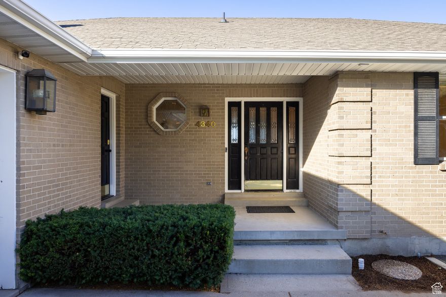 Nestled in a desirable neighborhood right in the heart of Holladay, this 8 bed 5 bath home has much to offer. The charming brick home boasts a formal living/dining area as well as an updated kitchen and family room, a large Primary Suite, and a useful side-entry mudroom with laundry. The downstairs also benefits from a large rec room with a full kitchen, a secondary laundry space, and a walkout basement entry - perfect for use as a separate apartment. There is flexibility in the use of the 8 bedrooms - as office space, den, or home gym and the plentiful storage space is sure to be useful. The classic brick design gives this home a timeless quality, and the plentiful windows bring light and open views to each room. The home is perfectly primed for small cosmetic updates to make the space yours, without any need for the hassle of a full renovation. Plus, solar panels on the back roof mean hefty electrical bills are a thing of the past. The home is a short fifteen minute walk away from the Holladay Village center, where you will find shopping, restaurants, a park, and community events. It is also an easy distance to the excellent Elementary, Jr. High and High Schools. You will feel the benefits of living in a walkable community with the ease of a nearby freeway entrance, offering quick access to skiing, hiking, downtown SLC, and the airport. With its location, flexible spaces and classic design, this property has potential to be a sound investment as well as a lovely family home.