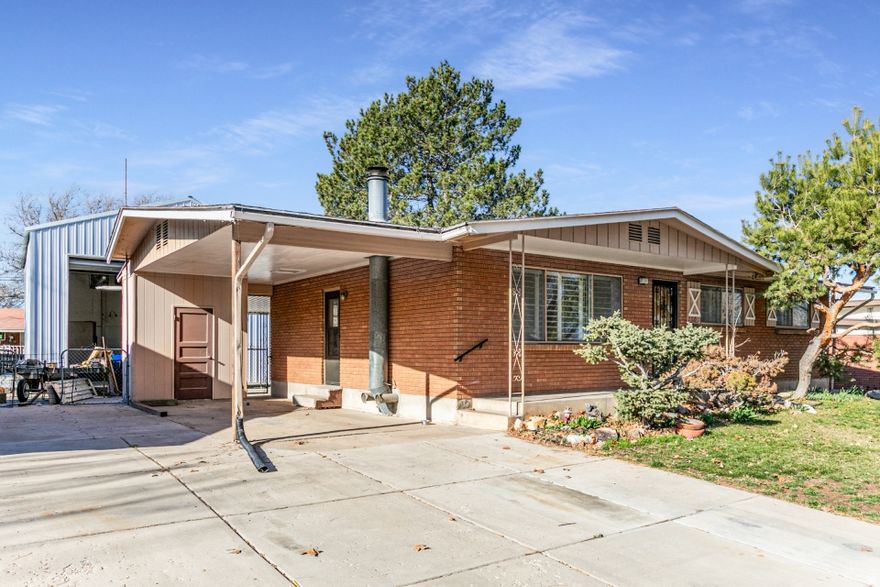 Step back in time with this 1963 rambler in Sunset-vintage, original, and ready for your vision. Offering 2,232 sq ft with 4 bedrooms and 1.75 baths, this classic single-level design features mid-century details, original hardwood floors hidden under the carpet, and the solid bones of long-term ownership. A recently installed HVAC system adds modern comfort and efficiency. The standout is the massive detached garage-fits up to 5 cars-with an extra-tall door for oversized vehicles and a huge loft for storage or a workshop. A covered carport provides additional parking. Inside, the home remains largely untouched-refinish the hardwoods and update to your style or keep the retro charm. Convenient location near parks, schools, shopping, and commuter routes. Loved by the same owner for 55 years, this is a rare chance to customize a well-cared-for home with outstanding garage capacity. Buyer to verify all info, including square footage and garage dimensions/door clearance. Square footage figures are provided as a courtesy estimate only and were obtained from county .  Buyer is advised to obtain an independent measurement.