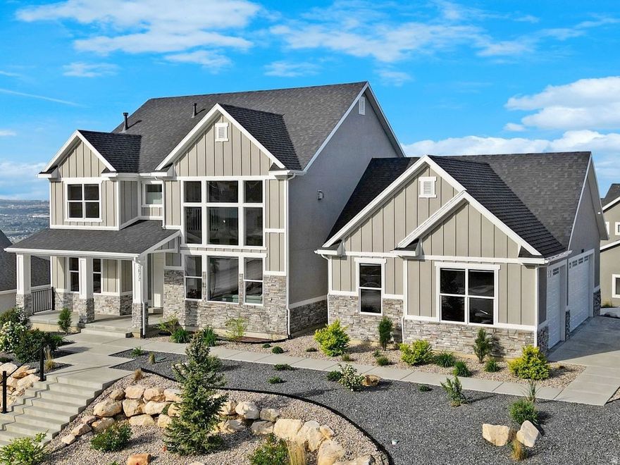 **OPEN HOUSE SAT 10 AM TO 1PM** Breathtaking Views | Designer Finishes | Flexible Living Spaces -  Welcome to this stunning two-story home nestled in the  prestigious Northview Estates, where panoramic views of the valley, mountains, and lake greet you at every turn.  Thoughtfully designed with elegance and functionality in mind, this home offers a seamless blend of luxury and comfort. Step inside to an open-concept main level featuring 9-foot ceilings, a bright and spacious great room with a cozy gas fireplace, and a gourmet kitchen equipped with stainless steel appliances, quartz countertops, a decorative vent hood, and a large pantry. A main-level guest bedroom and a versatile office/flex space make it easy to accommodate both work and visitors.  Upstairs, you'll find a spacious loft area and a luxurious primary suite with stunning views, a spa-like bathroom complete with a soaking tub, separate shower, dual sinks, and a generous walk-in closet. The walkout lower level offers room to grow or the perfect setup for a accessory dwelling unit (ADU), already featuring a private entrance, kitchenette space, large family room, and two spacious bedrooms-ideal for multi-generational living or rental income. With a 3 car garage, high-end finishes throughout, and unmatched natural beauty surrounding you, this home is truly a rare find.  This home is easy to show, come see it today OR Virtually walk through this home right now, click the tour link and check out the interactive 3-D tour.