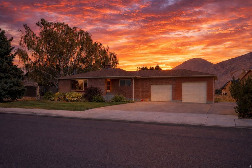 Located in a quiet, fantastic Mapleton neighborhood, this home is within walking distance of Mapleton Junior High and just a short walk to the Mapleton Parkway Trail, which connects through town and links to the Hobble Creek Trail system, offering miles of paved paths for walking, running, and biking. Mature trees on the property provide excellent shade and a peaceful setting.  The basement and main-floor bathroom have been recently updated, and the furnace has been replaced with a high-efficiency model. The basement is also stubbed for a kitchen, creating the potential for an accessory apartment. The layout could allow for a shared laundry area with access for both levels and the garage, offering a practical setup for multi-generational living or potential rental income.  (Photos with furniture/decor are virtually staged.)