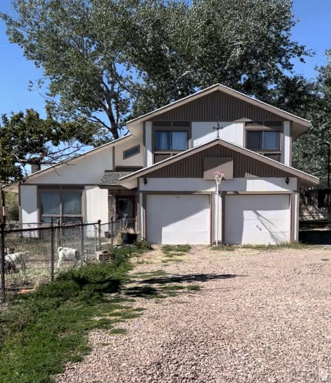 Charming 4 bedroom retreat on 2 acres! This home welcomes you with vaulted ceilings, large wood burning fireplace, tons of natural light, and a walkout balcony off the master to offer you serenity in your fully fenced private backyard. Outside, enjoy the expansive yard, mature trees, and wide-open spaces perfect for gardening, outdoor play, or simply relaxing by the fire pit under the stars. Plus, there is plenty of room for chickens, pets, or a small hobby farm! Schedule a showing today! Square footage figures are provided as a courtesy estimate only and were obtained from county records. Buyer is advised to obtain an independent measurement.