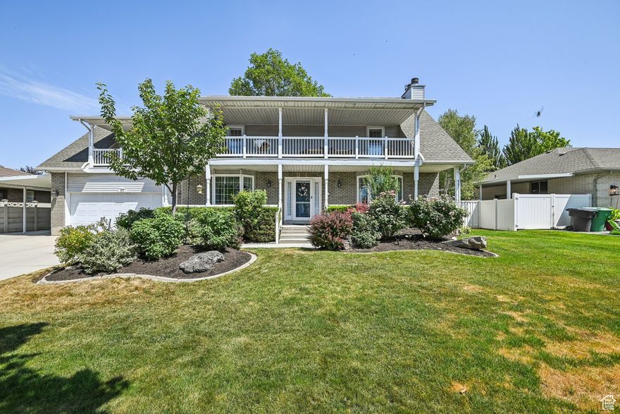 Don't miss your chance to own a beautiful home in the highly sought-after Dairy Meadows subdivision! Tucked away on a quiet cul-de-sac, this charming property features a covered front porch, upper balconies, RV parking, and a fully fenced backyard with a shade tree, covered deck, and a BBQ grill hooked up to natural gas. Inside, you'll find hardwood floors, crown molding, and three gas fireplaces for extra warmth and comfort in the winter. The home includes a formal living and dining room, an updated kitchen with solid surface countertops, a large island, and generous countertop space. The spacious master suite has a private balcony, two walk-in closets, and a granite double vanity. Upstairs offers dormer-style rooms with unique shapes and great storage, plus another large bedroom with its own balcony that could serve as a second master. The basement includes a huge family room, game area, flex space perfect for an office or future mother-in-law apartment, and cold storage under the porch. With laundry on the main floor, new exterior doors, natural gas available for a hot tub hookup, and paid-off solar panels keeping electric bills low, this home offers comfort, efficiency, and character in one of the area's most coveted neighborhoods.