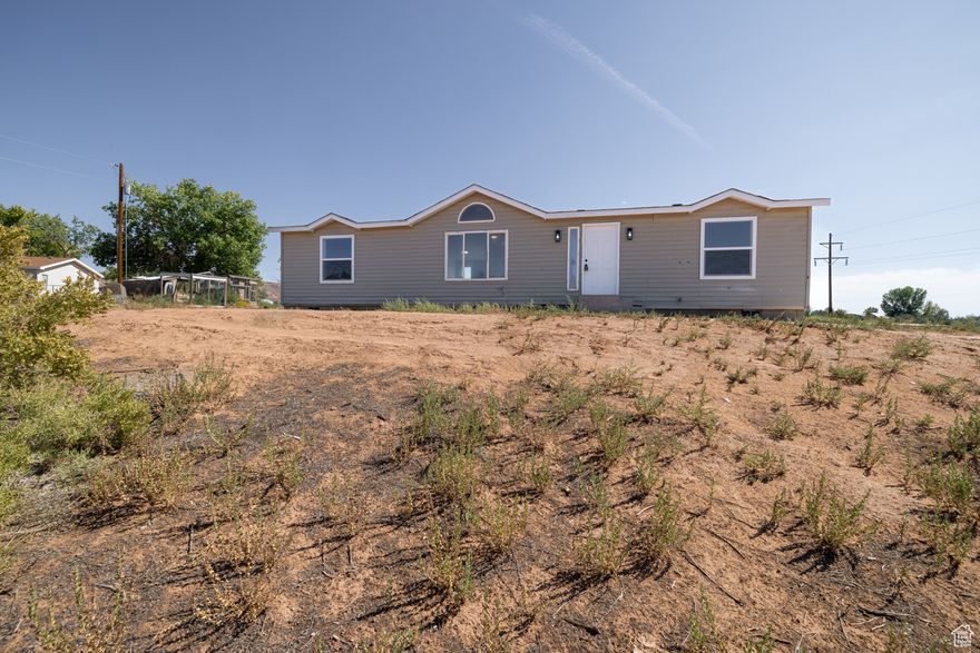 Experience peaceful country living on over 3 acres with this beautifully remodeled 3 bedroom, 2 bath home. Featuring a new roof, new windows and central heating and cooling to keep you comfortable year-round. Inside you'll find a fully updated kitchen with brand new appliances and cabinets. New flooring throughout and updated bathrooms make this home truly move-in ready. Whether you're looking for a quiet retreat, a hobby farm, or just more room and privacy-this property offers endless possibilities in a serene country setting.   Square footage figures are provided as a courtesy estimate only and were obtained from county records. Buyer is advised to obtain an independent measurement.