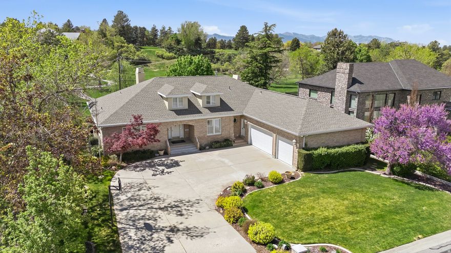 *OPEN HOUSE SATURDAY APRIL 18TH 12-3PM* Welcome to this exceptional 5,940 sq ft rambler, proudly owned by its original owner, perfectly positioned on the golf course and directly across from the Willow Creek Country Club -offering an unbeatable combination of location, views, and refined main-level living. Designed with both elegance and comfort in mind, this expansive home showcases a thoughtfully crafted open floor plan with generous living spaces, abundant natural light, vaulted ceilings and seamless flow for everyday living and entertaining.  The spacious great room is anchored by large windows that frame stunning fairway views, creating a peaceful backdrop throughout the main living areas. The kitchen is ideally situated for gathering and features ample cabinetry, extensive counter space,large walk in pantry and a functional layout that connects effortlessly to dining and living spaces. The primary suite offers a private retreat with generous proportions and convenient main-floor accessibility, perfectly complementing the home's true main-level living design. An oversized three-car garage provides ample space for vehicles, storage, and more.  The daylight walkout lower level expands the home's versatility with substantial square footage, ideal for entertaining, recreation, or multigenerational living. A private mother-in-law apartment with a separate entrance adds flexibility and convenience for extended family or guests, while thoughtful design elements throughout maximize comfort and maintain an inviting, open feel.  Step outside to enjoy serene golf course vistas, mountain views, mature landscaping, and easy access to Willow Creek Country Club amenities just steps away. Whether enjoying quiet mornings overlooking the greens or hosting gatherings in the spacious interior, this property offers a rare opportunity to own a premier golf course home with both privacy and proximity in one of the community's most desirable locations.Buyer to verify all information.