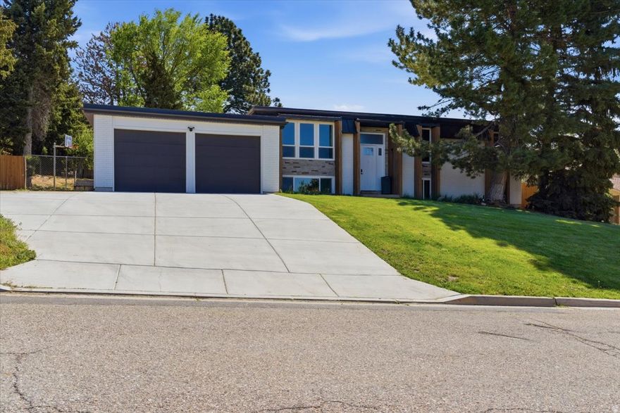 Amazing home surrounded by breathtaking mountain views, including Ben Lomond. Inside, you'll find 6 oversized bedrooms, 3 baths, spacious gathering areas, and ample storage. The home features two full kitchens on each level and a walkout basement, offering excellent potential for rental or multi-generational living. Step outside to a large fenced yard with an outdoor shed which includes a loft equipped with a wood burning stove; perfect for hobbies, a creative studio, or a fun kids' hangout. Home has a newer roof, recently updated exterior, new windows, and freshly poured concrete. All of this is within minutes from hiking trails, parks, and everything Pleasant View has to offer. Buyer is advised to obtain independent measurements.