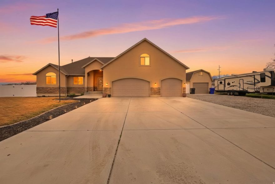 Welcome home to this fully finished 4,000 sq ft residence tucked away on a private road sits on just over an acre of land. Offering an ideal combination of space, privacy, and versatility, this property features 5 spacious bedrooms and 3.5 bathrooms designed for comfortable living. With two full kitchens and two laundry rooms, the layout is well-suited for multi-generational living, guest accommodations, or added flexibility to meet your needs. The fenced property includes a 32x32 detached shop with power and concrete, an above-ground pool, a storage shed with a built-in chicken coop, and above ground garden boxes. Recent updates include new kitchen appliances (oven, sink, and refrigerator), a new water heater with expansion tank, and a recently serviced HVAC system for added peace of mind. The property also includes 2 transferable (A) water shares. The pasture across the street is available to rent for $200 per month. A rare opportunity to own a spacious, private property with room to live, work, and grow.