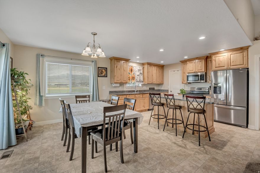 Incredible 3-Bed, 3-Bath Home on 5.91 Acres with Mature Orchard, Outbuildings, & Private Wells  Welcome to this homestead situated on 5.91 acres of lush, greenbelt land in beautiful Box Elder County. This remarkable property offers endless possibilities for farming, hobbyists, or those seeking peace and tranquility. Built in 2018, the 1,800 sq ft main level features an open, airy floor plan perfect for entertaining, while the unfinished 1,800 sq ft walk-out basement provides ample room for customization-whether you envision more living space, a home gym, or storage for your toys.  Key Features:  Land & Orchard: Over 5.9 acres of usable land, including a mature orchard, offering a serene rural retreat with space for expansion and customization. Enjoy the fruits of your labor with your own fresh harvest.  Agricultural Opportunities: The property is set up for livestock with outbuildings for animals, including pigs and chickens, plus an area dedicated to growing alfalfa and corn. Take full advantage of the land's agricultural potential with 5 shares of Bear River Canal water rights to irrigate your crops and garden.  Private Wells: The property comes with its own private wells, offering self-sufficiency and reliable water for the entire farm.  Greenbelt & Views: Enjoy the peaceful nature of Box Elder County, surrounded by wide open fields, picturesque views, and a rural atmosphere that's just minutes away from nearby amenities.  Outdoor Living: The large walk-out basement leads to a spacious backyard, ideal for outdoor living and entertaining. Whether you're hosting summer BBQs or simply soaking in the views, this space is perfect for enjoying the great outdoors.  This property offers incredible value, privacy, and an exceptional quality of life with ample room to grow, garden, raise animals, or simply enjoy the space. Don't miss out on this once-in-a-lifetime opportunity to own a piece of Box Elder County's beautiful farmland! Stay connected with fast, dependable internet ideal for remote work, and enjoy peaceful evenings in your stunning homestead.