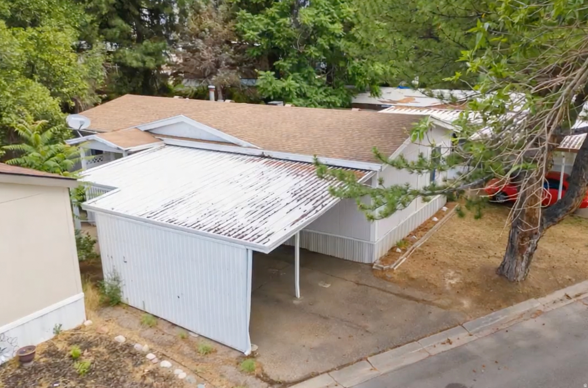 Single-story residence featuring a brown shingle roof and white siding