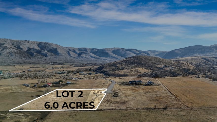 Build your dream mountain retreat on this expansive 6-acre homesite in the stunning mountain scenery in Wallsburg.  Located in a cul-de-sac surrounded by stunning mountain scenery and open space, this property offers the perfect balance of privacy, serenity, and convenient access to nearby cities.  Just minutes from Heber City, 30 minutes to Provo/Sundance, and within an hour of Park City and Salt Lake you can enjoy rural living while still within easy reach of shopping, dining, and everyday ammenities.  Outdoor recreation is right at your doorsept.  Spend summer days boating or fishing at Deer Creek or Jordanelle Reserviors and take advantage of world class skiing in the winter at Park City, Deer Valley and Snowbird.   With generous acerage and animal rights, there's plenty of room to create your ideal mountain lifestyle, whether that means space for horses, a hobby farm, or simply room to spread out and enjoy the views.  The property includes valuabel water shares, and power is stubbed to the subdivision.  Bring your plans, install a well and septic, and start builing the home you've always imagined in one of the valley's most peaceful and scenic settings. Buyer to verify all details