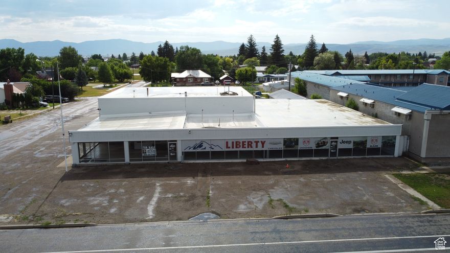 Prime Commercial Opportunity on Highway 30! This former car dealership in Montpelier, Idaho offers incredible visibility and endless potential. The property boasts a spacious showroom, large shop area with oversized garage doors, multiple offices, and a generous parts or retail space-ready to be reimagined for your business. Whether you're envisioning an auto shop, event center, retail hub, or community facility, this flexible space can meet your needs. With ample parking in the rear and high-traffic highway frontage, this is a rare chance to own a commercial building in a growing market. Bring your vision and make it happen!