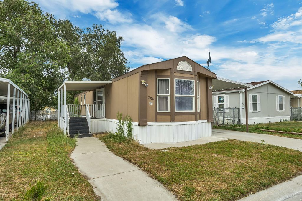 Photo of 7116 W BENDIXON DR S #11, West Valley City, UT 84128 (MLS # 2168695)