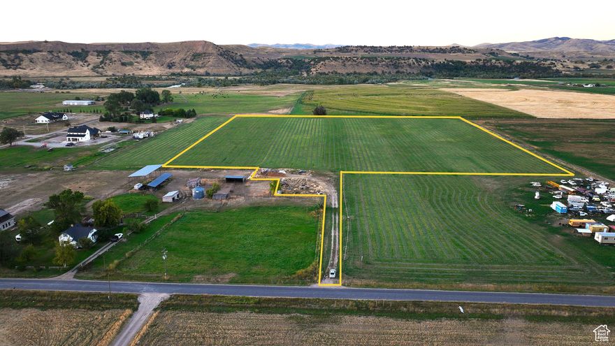 Irrigated, Flat, Buildable Ag Ground Near US 34 and US 36 Junction - Irrigated agricultural ground with potential to be subdivided into three residential parcels-  Flat lot adjacent to Dougway View and Eagle View Estates Subdivisions and irrigated farmland - Flat terrain with mountain view - 50 foot plus road frontage and easement providing driveway access - 16 shares of Riverdale Irrigation Company water available, pressurized with wheel line sprinklers and pump -  Year-round paved country road access - Overhead power available along 3200 North - Surveyed - Separate stock water well - Less than two miles from US 34 -  Partially fenced - HOA - Area fishing for smallmouth bass, walleye and yellow perch.  ----Tucked in the scenic Riverdale Valley and surrounded by irrigated farm ground and rural residential homes with year-round paved road access, this piece could make an ideal homestead or investment opportunity.  Escape the hustle and bustle of the city and enjoy a little privacy afforded by this flag lot, nestled in off the road with driveway access and approximately fifty feet of road frontage.  This lot is part of Dougway View Subdivision with the potential to be subdivided into three separate residential parcels.    Bring your horses or other livestock and enjoy country living with beautiful valley and mountain views and the convenience of proximity to Preston and Logan, Utah.  This property has been surveyed and boasts sixteen shares of Riverdale Irrigation Company water, which is available pressurized with wheel line sprinklers and pump.  It is actively being farmed and currently planted in hay and equipped with a stock water well.  A build will require a well to be drilled for culinary water, a perc test for a future septic system and power pulled from the road.  If you are searching for land for your year-round residence, homestead or investment opportunity, this could be the one.    Bear River Hot Springs is just a mile and a half away.  Treat yourself to a relaxing soak in the hot tubs or therapeutic jetted tub which are fed by natural hot water.  Bring the family and enjoy the large outdoor swimming pool, water slide, children's pool, gaming room and pavilions.    Cache National Forest and Mt Naomi Wilderness offer thousands of miles of trails and roads to explore in ATVs, horseback riding, mountain biking, hiking, backpacking and hunting.  The winter months offer a winter wonderland to explore snowmobiling, cross-country skiing and snowshoeing.  Oneida Canyon Recreation Area is located on Oneida Narrows Road and offers four season recreation.  Enjoy Boating, swimming and fishing at the reservoir, floating and fishing on the Bear River as well as upland game hunting, camping, hiking, backpacking, bird watching, wildlife viewing, cross country skiing and snowshoeing along the beautiful Bear River.  This is available to the public as part of the Wildlife Habitat Management Area provided by PacifiCorp who owns and manages the adjacent property along the Bear River and, also by the U. S. Department of the Interior Bureau of Land Management