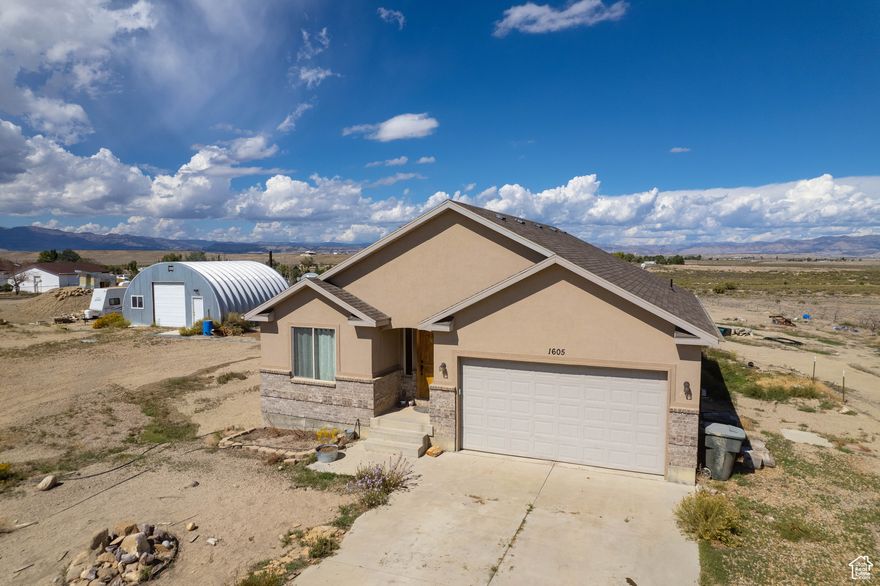 Discover the perfect balance of comfort and country living on 2.63 acres. This 6 bedroom 3 bath home is beautiful and functional thoughtfully designed for both convenience and lifestyle. This home welcomes you in with vaulted ceilings and bright open layout. 2 car attached garage, a detached shop for projects and storage, RV parking and chicken coop. The acreage is ideal for horses or outdoor hobbies with plenty of space to make it your own. Peaceful setting with expansive views by day and an incredible canopy of stars at night. This is more than just a home, it's a place where peace, space and possibility come together. Call today to schedule your tour of this incredible home.  Square footage figures are provided as a courtesy estimate only. Buyer is advised to obtain an independent measurement.