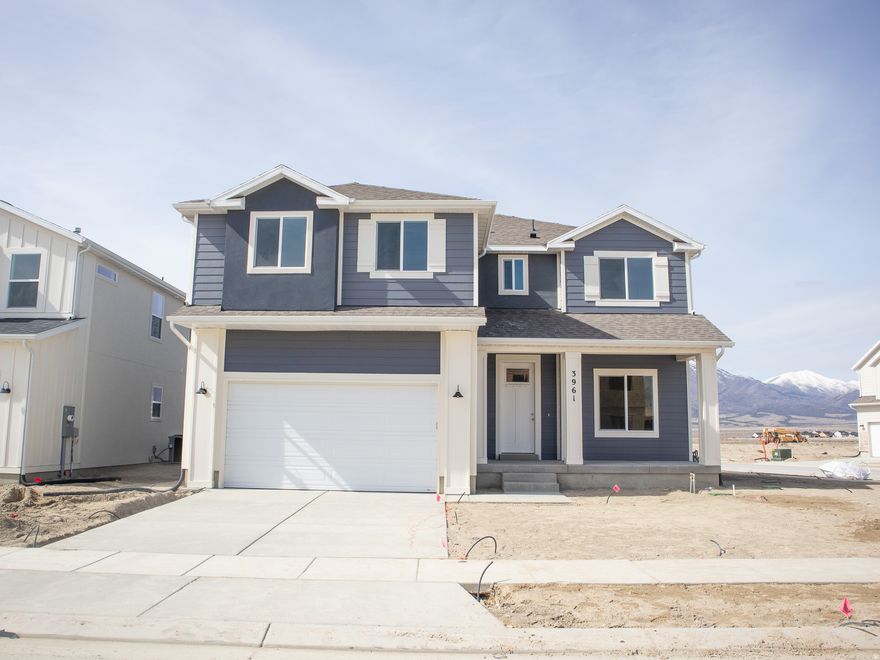 AMAZING $15,000 INCENTIVE TOWARDS CLOSING COSTS, RATE BUYDOWN, OR PRICE REDUCTION REGARDLESS OF LENDER! Must-see Harmony Community in Eagle Mountain! Move-in ready! This beautiful home built by Flagship Homes features 4 bedrooms + loft, 2.5 bathrooms, quartz slab countertops, painted cabinets, laminate flooring on the main level, an extended front porch, landscaped front yard and 2 car garage. The backyard can be landscaped for an additional charge. The primary bedroom has a vaulted ceiling, large walk-in closet, and dual sinks with a separate tub/shower. With an unfinished basement, this home provides space for storage and room to grow. (If preferred, basement can be finished for an additional charge.) 1GB fiber optic internet included in the HOA dues. Call for more information or stop by our model home at 656 E. Nathan Street, Eagle Mountain for a tour. Model home hours: Monday-Saturday 11 AM - 6 PM. Buyers to verify all information. Square footage is from house plans.