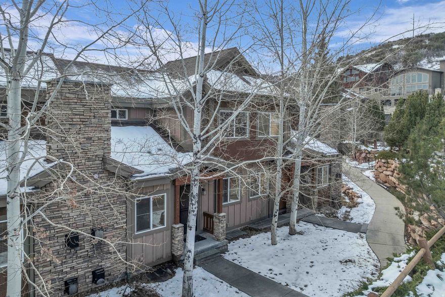 Located in desirable Bear Hollow Village, this inviting, fully furnished, turnkey townhome offers comfort and excellent convenience. With 4 bedrooms and 3 full bathrooms, the home features a functional layout with two separate living areas, one of which can serve as a second primary suite. The flexible design works beautifully for entertaining, relaxing, or offering additional privacy for guests. Enjoy nearby access to Park City's extensive hiking and biking trails, along with close proximity to the shops, grocery stores, and restaurants of Kimball Junction. The Canyons ski lifts and Park City Canyons Village Base are just minutes away, and the free public transit system makes getting around simple. Salt Lake International Airport is only 30 minutes away, providing easy year-round access. Community owners can take advantage of resort-style amenities including a private clubhouse, year-round hot tub, seasonal pool, and fitness center. Whether you are seeking a furnished mountain escape, a primary residence, or an investment opportunity with nightly rentals permitted, this Bear Hollow townhome delivers both versatility and convenience.