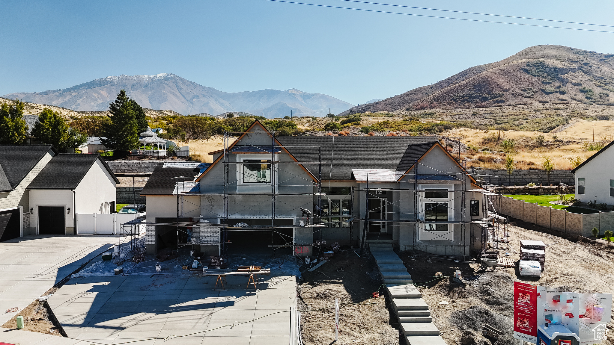 $15,000 Preferred Lender Incentive! Discover this stunning 6,400 sq ft Roosevelt currently under construction, designed with comfort, style, and breathtaking views in mind. The main floor primary suite offers convenience and privacy, while the upper level features two spacious bedrooms and a versatile loft. From the backyard, enjoy sweeping mountain views, and from the front, take in panoramic vistas of Utah Valley and Payson. The three-car garage provides ample space for vehicles and storage, while custom finishes and unique design elements add a touch of luxury throughout. Situated on a partially landscaped lot, this home offers the perfect blend of elegance and functionality. Estimated completion mid-November-secure your dream home before it's gone!