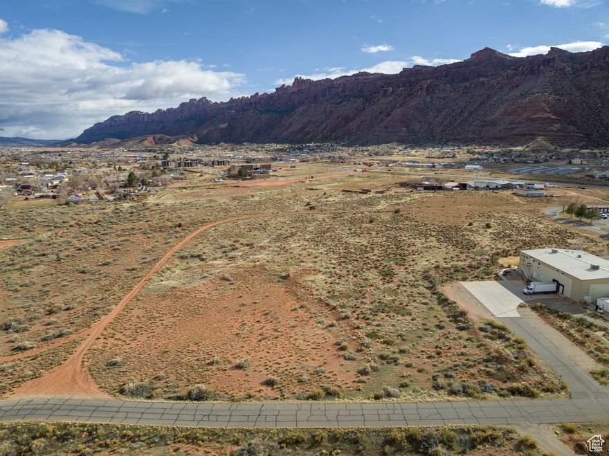 Premier Commercial Lot located in Moab's Strategic Growth Corridor. Secure your place in McKnight Commercial Subdivision-perfectly located and just minutes from downtown Moab. Zoned General Business (GB), this subdivision offers unmatched versatility for commercial use, accommodating retail, office space, services, and more. Prime Location: Positioned between HWY 191 and Spanish Valley Drive, only three miles south of downtown, providing exceptional accessibility and visibility. Broad Use Zoning: General Business zoning supports diverse commercial opportunities, making these lots ideal for a variety of innovative business concepts. Limited Availability: Only 9 lots remain out of the original 17. Development-Ready: Road and critical utilities-water, sewer, power, telecom-are fully established, enabling immediate development. Take advantage of this opportunity to be part of Moab's Limited Commercial Landscape.