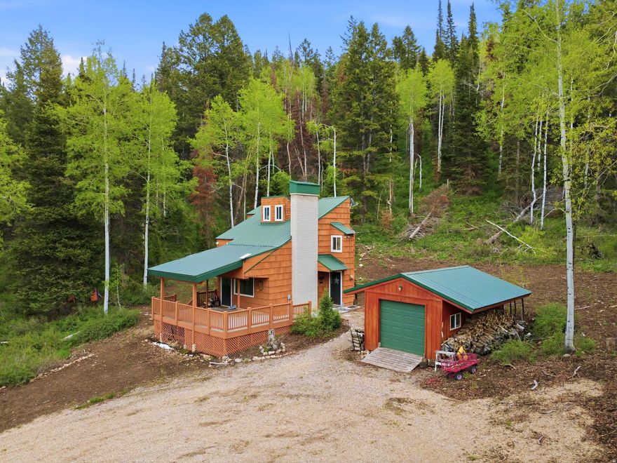 Nestled at the end of a dead end street on one of the best lots in Pine Mountain is this beautiful 2 bed 2 bath cabin packed with charm and character. The flat 1.63 acre lot provides ample seclusion and creates a true sense of immersion in the surrounding Uinta National Forest and the wildlife that reside here. 54 E Targhee is an ideal basecamp for any recreational pursuits one may want to engage in off property, with direct national forest access from Pine Mountain in addition to miles of HOA trails, perfect for ATV's, hiking, biking, and snowmobiling. Supplemental to all that this cabin has to offer there is an opportunity to assume the lease on a coveted storage unit at the east gate, this is a rare opportunity for storage in addition to the detached garage on property that often takes years to acquire. This cabin and the fantastic lot it sits on make it truly an opportunity not to miss. Square footage figures are provided as a courtesy estimate only.  Buyer is advised to obtain an independent measurement.