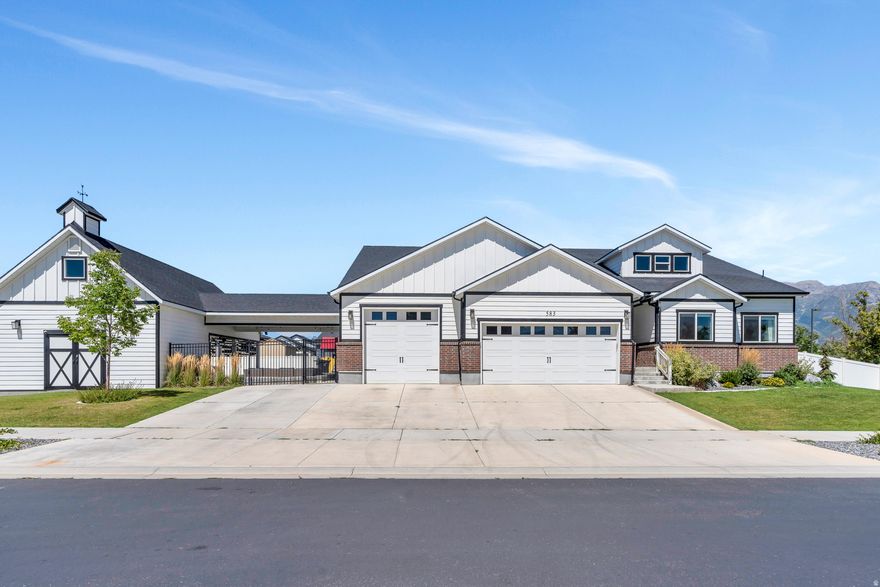 This freshly painted two-story home, is located in the vibrant and highly desirable community of Vineyard, Utah. Offering more than 6,000 square feet of thoughtfully designed living space, the home features seven generously sized bedrooms and five full bathrooms-ideal for a large household, guests, or multi-generational living. A spacious four-car garage provides ample room for vehicles, storage, or even a home gym. The backyard is an entertainer's dream, designed for both relaxation and fun, with a large fire pit, dedicated outdoor entertaining space, and a private basketball court. A trampoline and swing set create an inviting space for all ages, while raised vegetable garden boxes offer the opportunity to grow fresh produce this summer. With convenient RV parking, the property is well-suited for outdoor enthusiasts or those needing additional space for hobbies or a home-based business. Inside, the home offers abundant storage throughout, along with a large unfinished room that presents endless possibilities-whether envisioned as a yoga studio, home theater, sports training room, or customized flex space. Ideally located, the home is surrounded by shopping and dining options for everyday convenience. A neighborhood park sits less than a block away, while scenic jogging and biking trails along Utah Lake provide access to water activities and breathtaking views. The elementary school is conveniently located kitty-corner across the street, adding to the home's exceptional livability. Combining generous space, luxury features, and an unbeatable location, this property offers the perfect blend of comfort, functionality, and community living.
