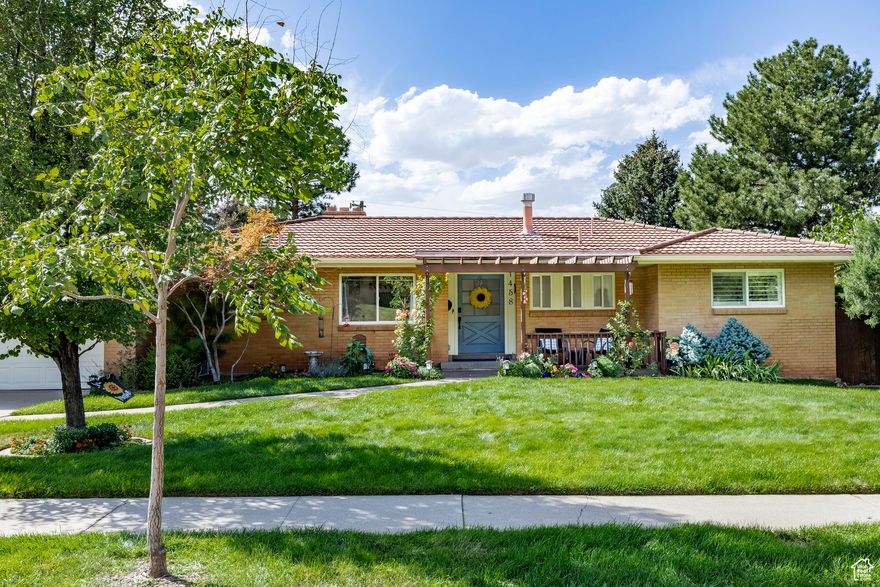 Nestled in the highly sought-after St. Mary's neighborhood, 1458 S. Wilton Way offers a harmonious blend of classic charm and modern comfort. With three well-appointed bedrooms on the main floor, this home welcomes you into a living room where rich hardwood floors, a gas fireplace, and sliding doors invite effortless indoor-outdoor living. Step onto the covered balcony for morning coffee or retire to the expansive deck off the formal dining area for an ideal space to dine under the stars or watch your furry companions roam the generous, .29-acre yard below. The kitchen features granite countertops with room for stools on the breakfast bar and room for casual dining, a gas range and stainless steel appliances, plus a couple of kitchen windows that look onto the Utah mountains. Downstairs, the walkout lower level impresses with three additional spacious bedrooms, each with large windows that fill the space with natural light. A beautifully updated bathroom features marble finishes and crisp white cabinetry, while a second gas fireplace adds warmth to the inviting family room, which opens directly to the flat, grassy backyard which is perfect for play, relaxation, or entertaining. This level also includes a functional laundry area complete with a sink, countertop space, and storage for everyday ease. Curb appeal abounds with a pergola-covered front patio, perfect for watching the rhythms of the neighborhood pass by. Mature perennials and lush landscaping offer year-round beauty and privacy in the backyard. This is more than a home, it's a sanctuary tucked into one of the city's most desirable enclaves. Ideally located near Emigration Canyon, Research Park, Hogle Zoo, hospitals, and the University of Utah, this home also offers quick access to downtown Salt Lake City, world-class ski resorts, and the Salt Lake International Airport.