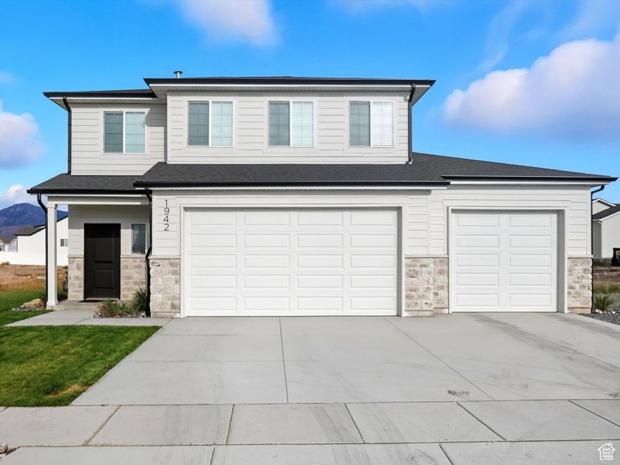 This gorgeous home features 3 beds, 2.5 baths and a large 3 car garage with 8 ft tall garage doors. Located in a beautiful neighborhood in West Haven UT, this community has trees, street lights, walking trails and a park. It is also located in the district of brand new West Field High School, a new Junior High and Elementary. Be sure to check out the large laundry room which sits on the same floor as the rest of the bedrooms, so you don't have to carry laundry baskets up and down stairs. The laundry room also offers a large amount of storage space. Coming in from the garage, there is a well designed space to put coats and shoes, so they are out of the way. This home was well designed with beautiful finishes throughout, as well as a nice landscaped front yard. Come take a look!