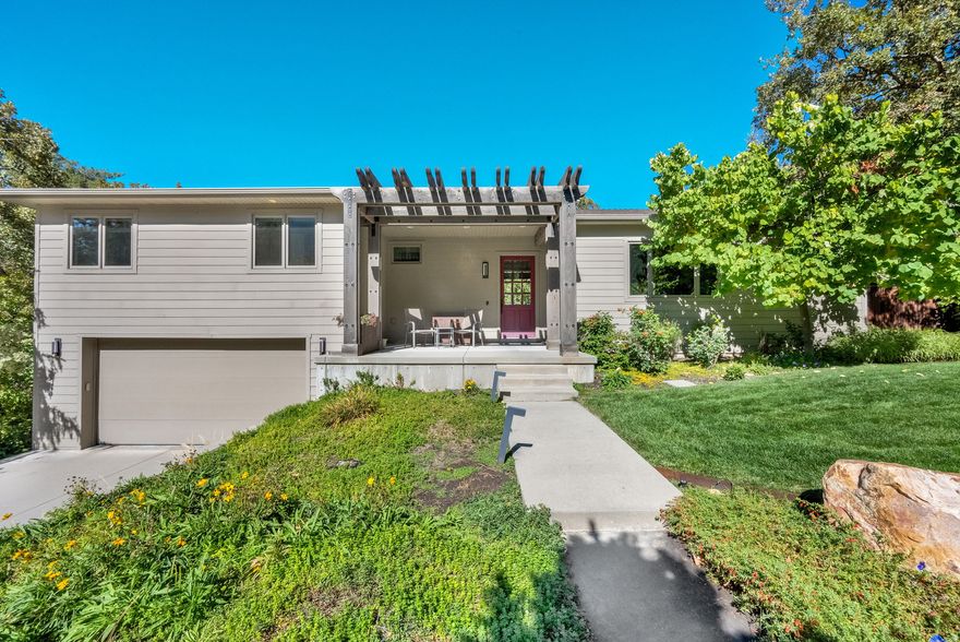 Nestled in the heart of highly sought-after Olympus Cove, this stunning home offers the opportunity to live in the mountains while enjoying all the convenience of the valley below. Flooded with natural light from gorgeous windows throughout, the spacious, open floorplan creates an inviting atmosphere ideal for both everyday living and entertaining. At the heart of the home is a massive kitchen featuring double ovens, double dishwashers, a huge island, and expansive windows that bring the outdoors in-perfect for hosting and gathering. Situated on an incredible and usable .38-acre lot, the property has breathtaking mountain and valley views, two patios, and a charming firepit. Inside, the generous primary suite features a large ensuite bathroom. All of the bedrooms are spacious, and the huge living area and walk-out basement add exceptional versatility, making this home as functional as it is beautiful. Buyer to verify all MLS information, including square footage.